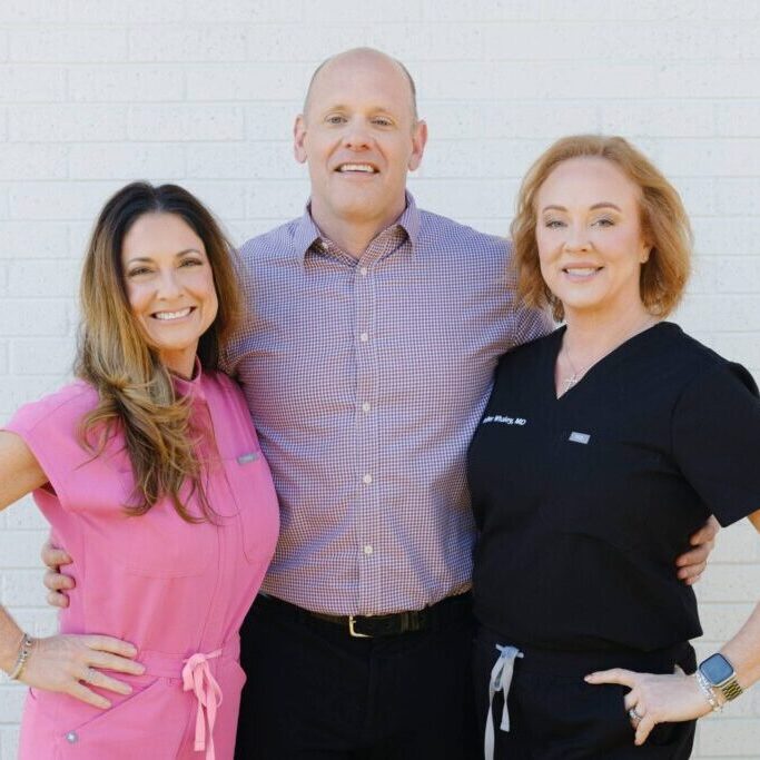 Professional license defense attorney with his physician wife and RN sister.
